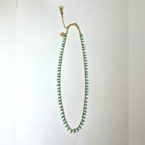 Kendra Scott gold chain necklace with turquoise beads hanging off chain